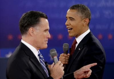 In this Oct. 18, 2012 file photo, President Barack Obama, right, and Republican presidential candidate, former Massachusetts Gov. Mitt Romney exchange views during the second presidential debate at Hofstra University in Hempstead, N.Y. (AP)