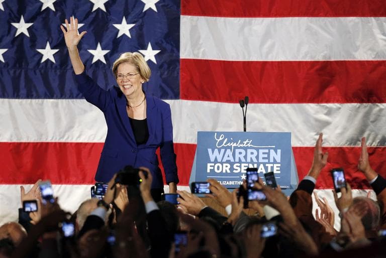Democrat Elizabeth Warren waves to the crowd before giving her victory speech after defeating incumbent GOP Sen. Scott Brown in the Massachusetts Senate race (Michael Dwyer/AP)