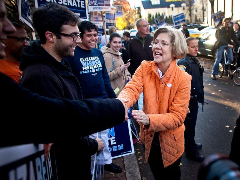 U.S. Senate candidate Elizabeth Warren greets supporters Tuesday morning outside of the Graham and Parks School in Cambridge. (Dominick Reuter/WBUR)