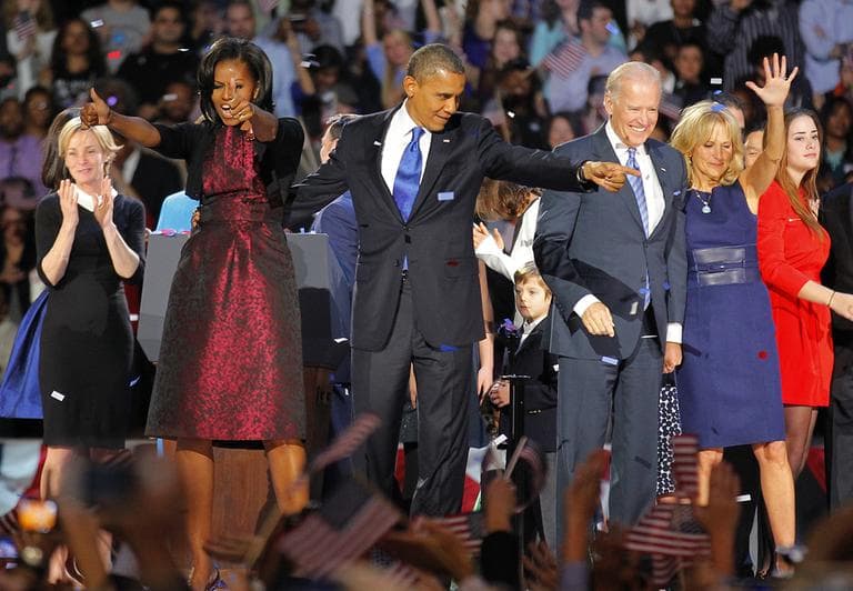 President Barack Obama , joined by  his wife Michelle, Vice President Joe Biden and his spouse  Jill acknowledge applause  after Obama delivered his victory speech to supporters gathered in Chicago early Wednesday morning. (AP Photo/Jerome Delay)