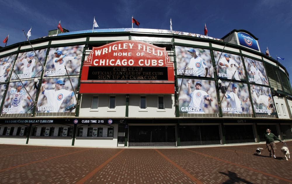 The Chicago Cubs reduced ticket prices for fans attending games at Wrigley Field, but many fans may only save a marginal amount. (Nam Y. Huh/AP)