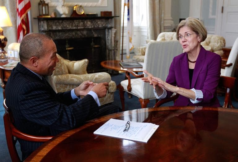 U.S. Sen.-elect Elizabeth Warren speaks with Gov. Deval Patrick in the governor&#039;s office at the State House on Thursday (Steven Senne/AP)