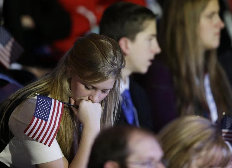 A supporter reacts to voting results displayed on a television screen during Republican presidential candidate and former Massachusetts Gov. Mitt Romney's election night rally, Tuesday, Nov. 6, 2012, in Boston. (AP)