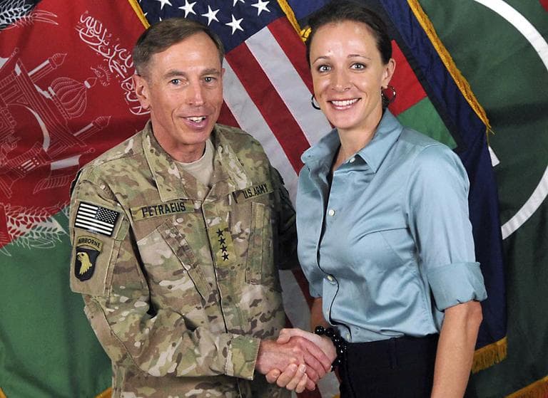 This July 13, 2011, photo made available on the International Security Assistance Force's Flickr website shows the former Commander of International Security Assistance Force and U.S. Forces-Afghanistan Gen. Davis Petraeus, left, shaking hands with Paula Broadwell, co-author of "All In: The Education of General David Petraeus." (ISAF/AP)