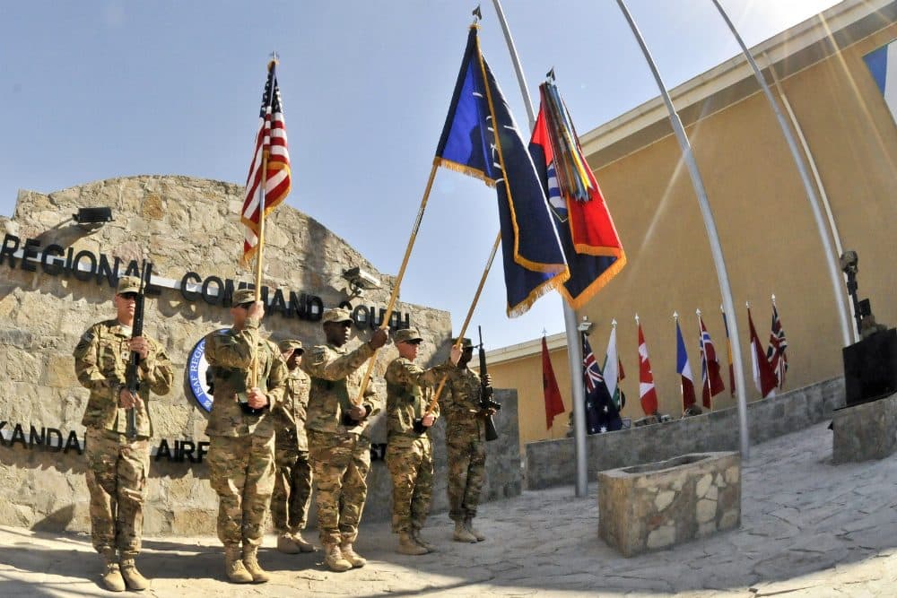 Color guard members present the colors for Regional Command South during a Veterans Day ceremony at the command's headquarters on Kandahar Airfield, Afghanistan, Nov. 11, 2012. (Staff Sgt. Brendan Mackie/U.S. Army)