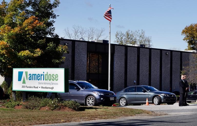 Two men stand guard outside the entrance to Ameridose LLC in Westborough in this Oct. 11 file photo. (Elise Amendola/AP)