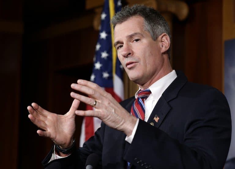 Sen. Scott Brown speaks during a media availability on Capitol Hill on Tuesday. (Alex Brandon/AP)