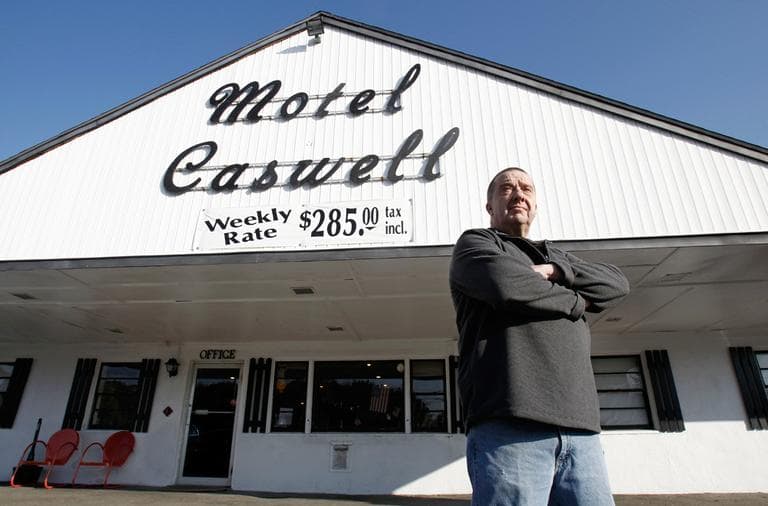 On Nov. 9, owner Russ Caswell stands outside his Motel Caswell in Tewksbury. (Winslow Townson/AP)
