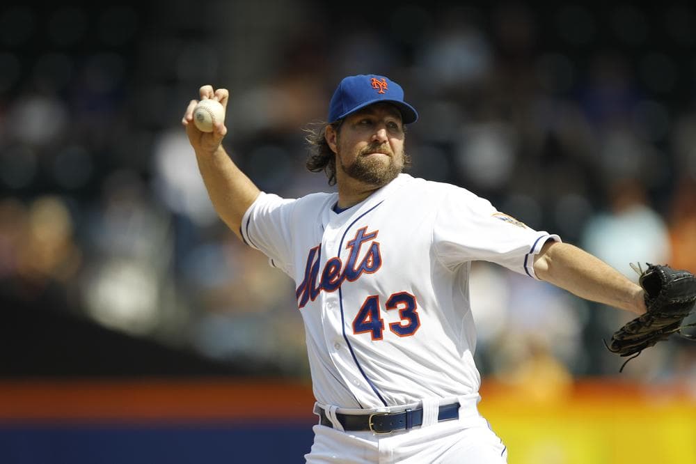 The knuckleball has a rich, quirky history, but New York Mets pitcher R.A. Dickey is the first knuckleballer to win the Cy Young Award. (Kathy Willens/AP)