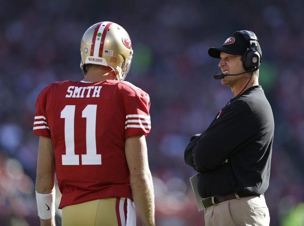 Last Sunday, San Francisco 49ers quarterback Alex Smith threw a touchdown after suffering a concussion. (Marcio Jose Sanchez/AP)