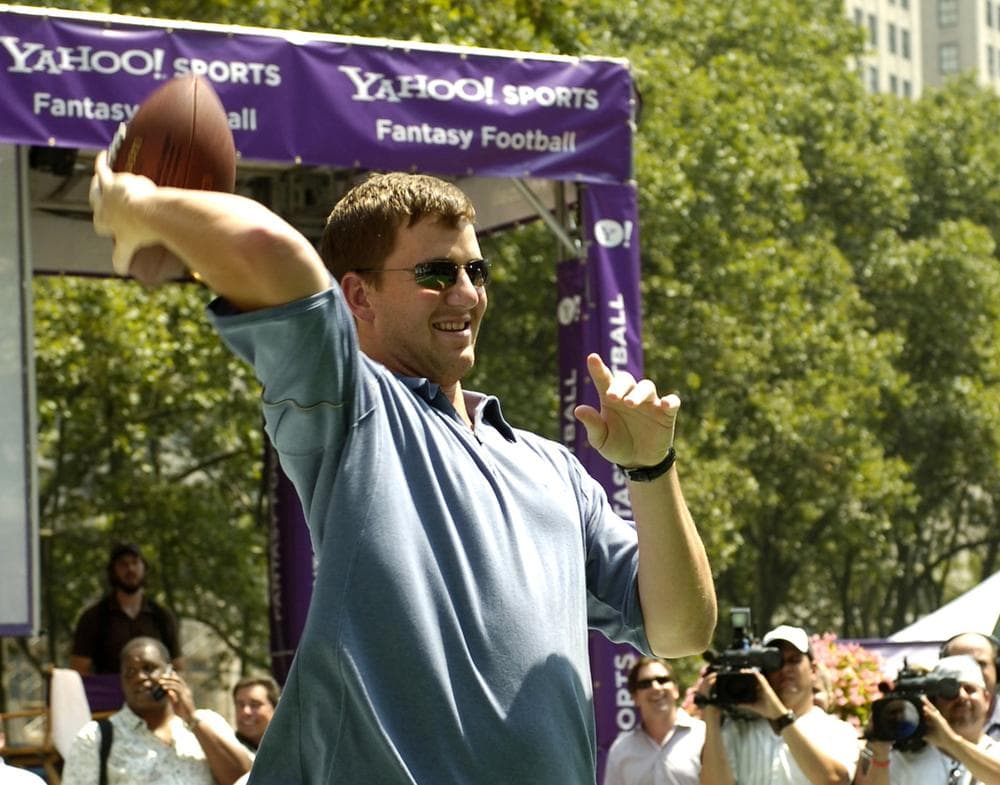 Eli Manning of the New York Giants throws a pass at the Yahoo! Sports Fantasy Football training camp in New York City. (Bill Kostroun/AP, Yahoo! Sports)