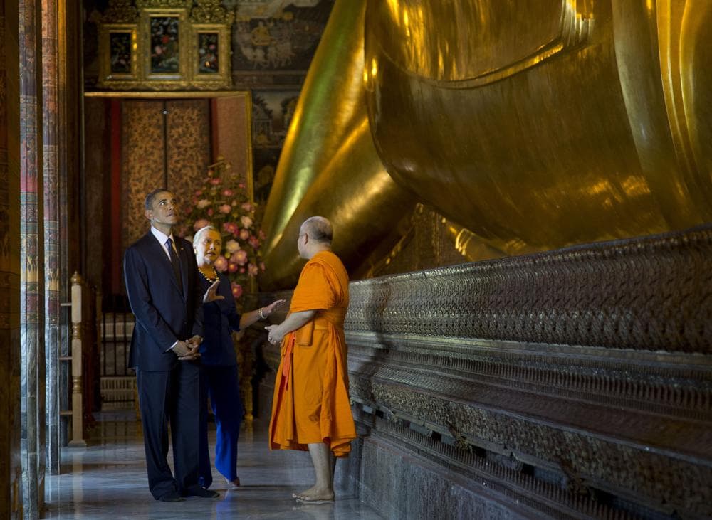 President Obama and Secretary of State Hillary Rodham Clinton tour the Viharn of the Reclining Buddha on Sunday. (Carolyn Kaster/AP)