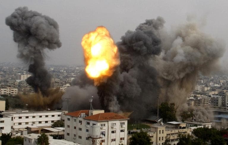 Smoke and a ball of fire are seen after an Israeli air strike in Gaza City on Wednesday. (Hatem Moussa/AP)