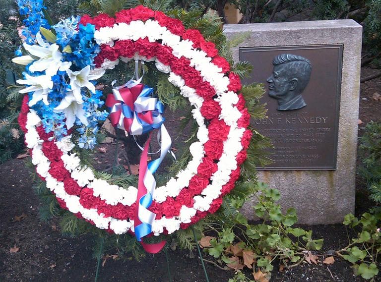 Rangers place a wreath on the commemorative marker at the birthplace of John. F. Kennedy in Brookline, Mass. (National Park Service)
