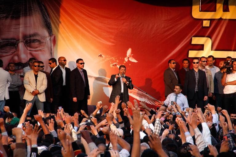 Egyptian President Mohammed Morsi speaks to supporters outside the Presidential palace in Cairo, Egypt on Friday. (Aly Hazaza, El Shorouk/AP)
