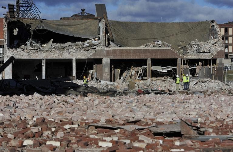 Inspectors assess damage, Saturday, Nov. 24, 2012, around the area of a gas explosion that leveled a strip club in Springfield, Mass., on Friday evening. (AP/Jessica Hill)