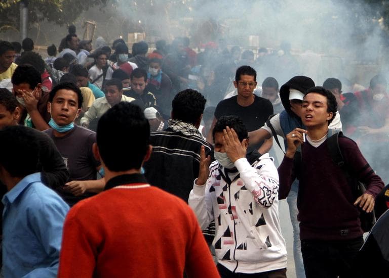 Egyptian protesters clash with security forces, not pictured, near Tahrir Square in Cairo, Egypt, on Sunday. (Ahmed Gomaa/AP)