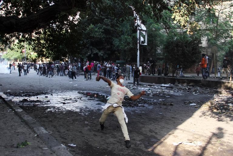 Egyptian protesters clash with security forces near Tahrir Square in Cairo on Sunday. (Ahmed Gomaa/AP)