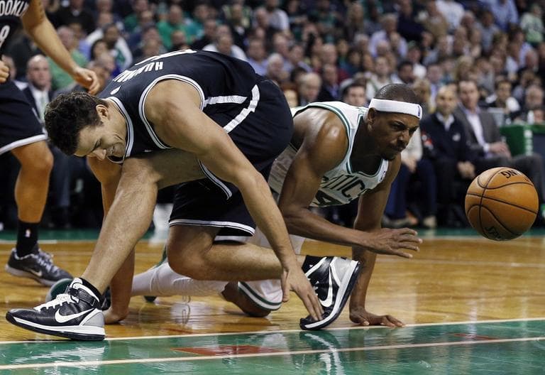 Brooklyn Nets&#039; Kris Humphries, left, and Celtics&#039; Paul Pierce scramble for a loose ball.(AP/Michael Dwyer)