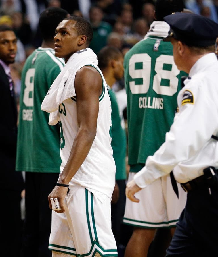 The Celtics&#039; Rajon Rondo walks off the court after being ejected in the second quarter against the Brooklyn Nets on Wednesday night. (Michael Dwyer/AP)