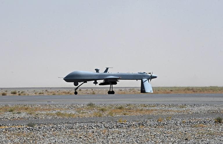 A U.S. Predator unmanned drone armed with a missile stands on the tarmac of Kandahar military airport in Afghanistan. (AP)