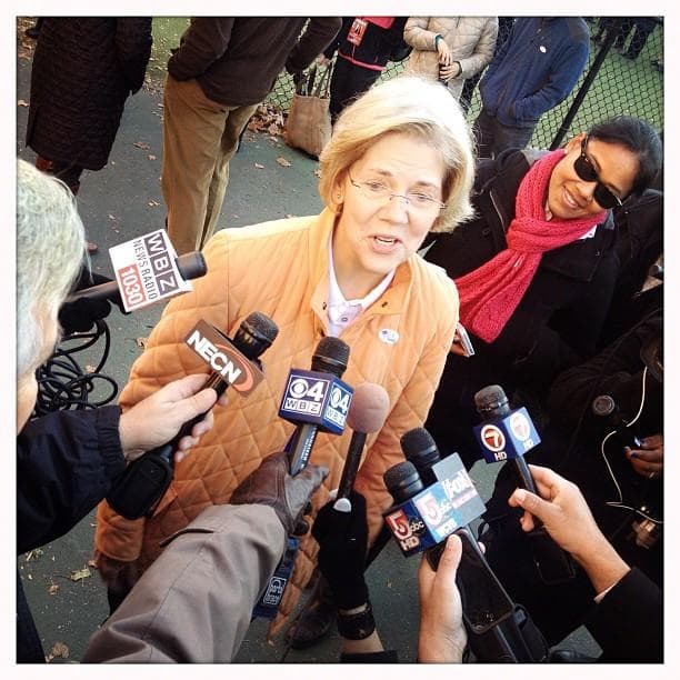 Elizabeth Warren speaks to the media after voting in Cambridge (Dominick Reuter/WBUR)