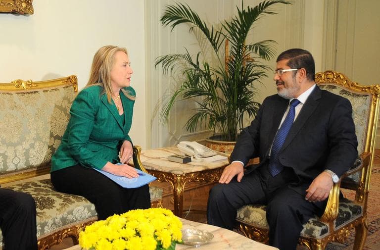  U.S. Secretary of State Hillary Rodham Clinton, center, meets with Egyptian President Mohammed Morsi, right, and Egyptian Foreign Minister Mohammed Kamel Amr, left, in Cairo, Egypt, Wednesday, Nov. 21, 2012. (AP)