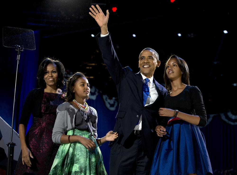 President Barack Obama waves as he walks on stage with first lady Michelle Obama and daughters Malia and Sasha at his election night party Wednesday, Nov. 7, 2012, in Chicago. (Carolyn Kaster/AP)