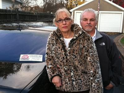 Maryann and Steve Davis' daughter, Debra, was killed in a drunk driving accident following the New England Country Music Festival at Gillette Stadium in 2008. Their car's bumper sticker memorializes Debra, and calls for help to stop underage drinking at the now-titled Countryfest. (David Boeri/WBUR)
