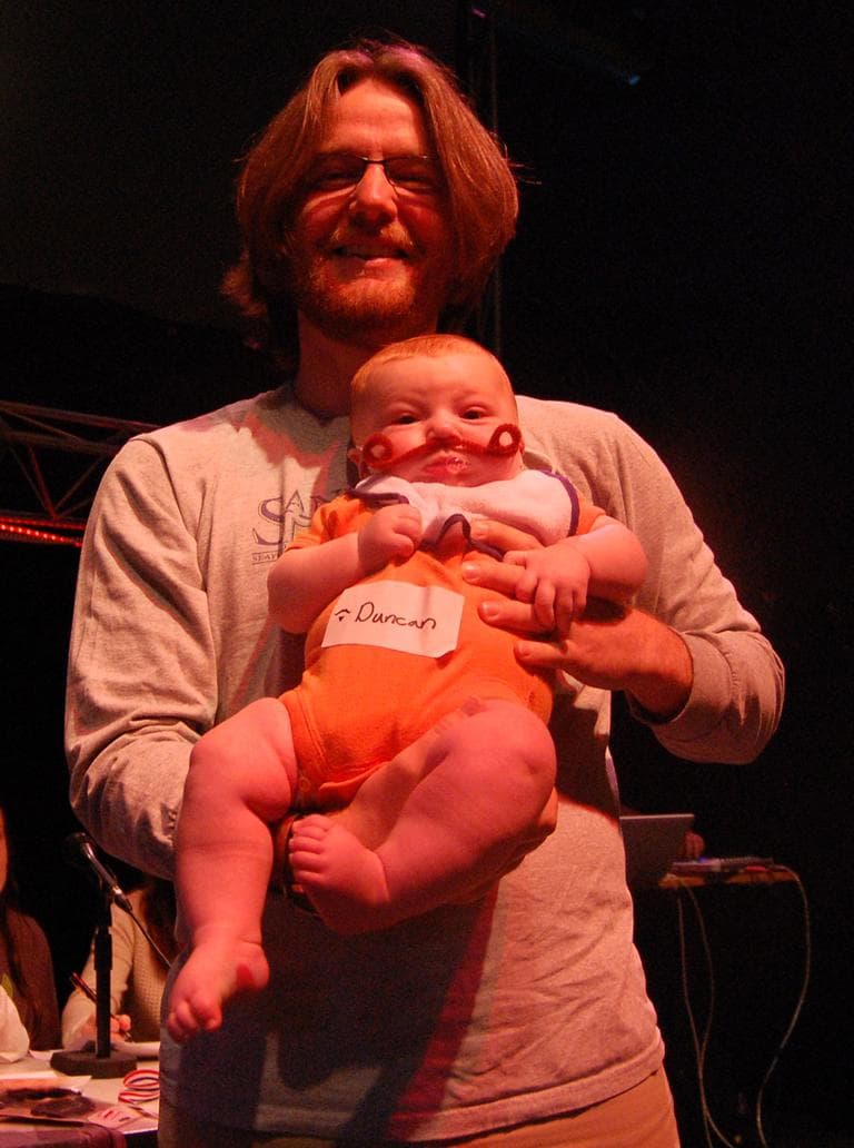 Three-month-old Duncan Ruthven, a finalist for best fake beard or mustache, was assisted by his dad Tyler. (Greg Cook)