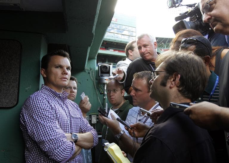 Boston Red Sox general manager Ben Cherington, left, speaks with reporters before a baseball game in August. (Steven Senne/AP)