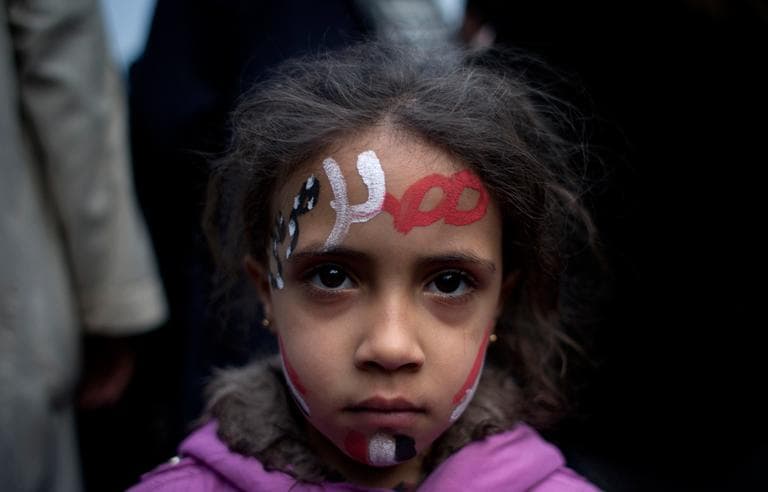 A girl with the colors of Egypt's national flag and Arabic that reads, &quot;Egypt, Morsi,&quot; painted on her face attends a demonstration in front of Egypt’s top court, in Cairo, Egypt on Sunday. (Nasser Nasser/AP)