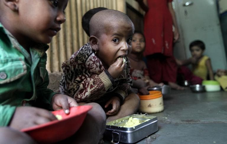 Malnourished children eat a meal at the Apanalay center, an organization working with malnourished children, in Mumbai, India, in January, 2012. (Rajanish Kakade/AP)