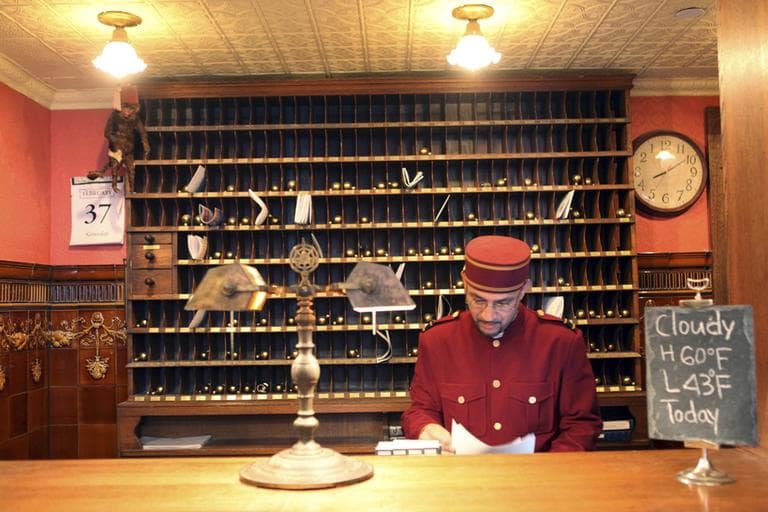 A man works at the front desk of a hotel in New York City's Greenwich Village in March 2009. (Mary Altaffer/AP)