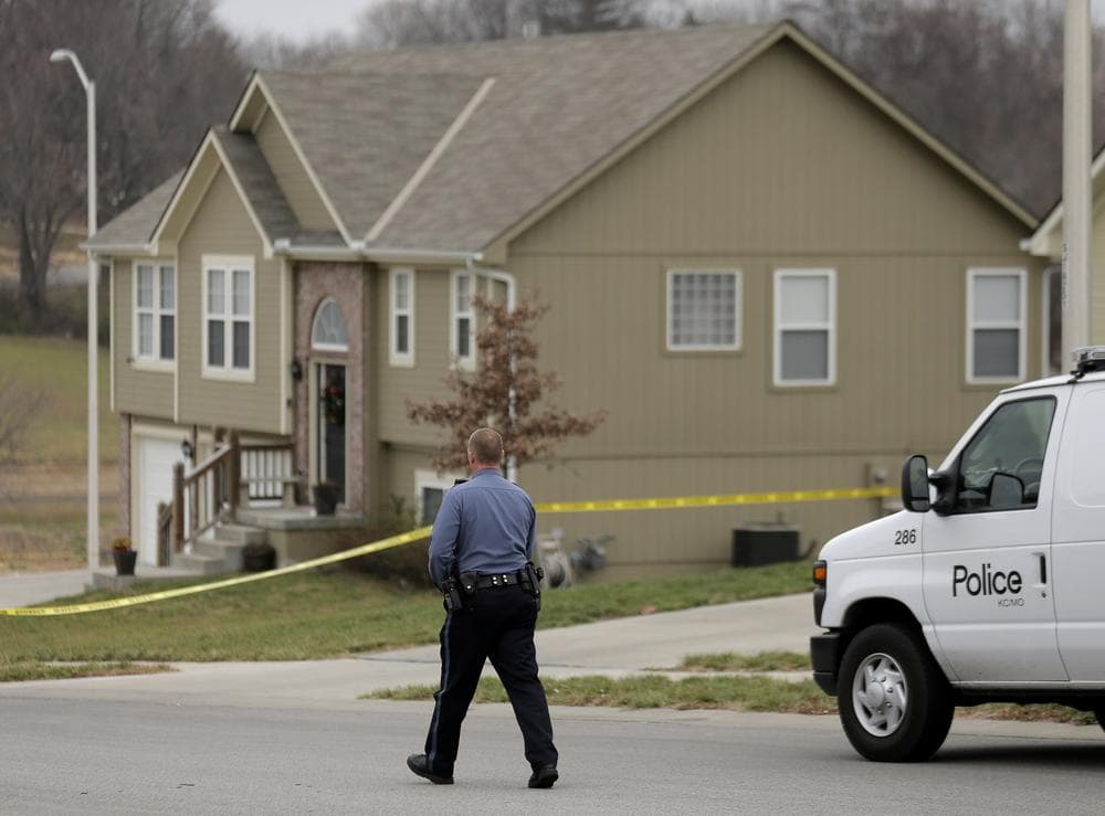 An officer walks outside the Independence, Mo., house where police say Kansas City Chiefs linebacker Jovan Belcher fatally shot his girlfriend last weekend. Blecher later shot himself outside the Chiefs' training facility. (Charlie Riedel/AP)