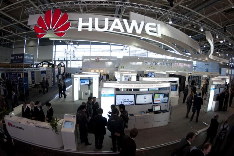 Visitors stand at the Huawei booth at the CeBIT computer expo in Hannover, Germany, in March. (Nigel Treblin/DAPD)