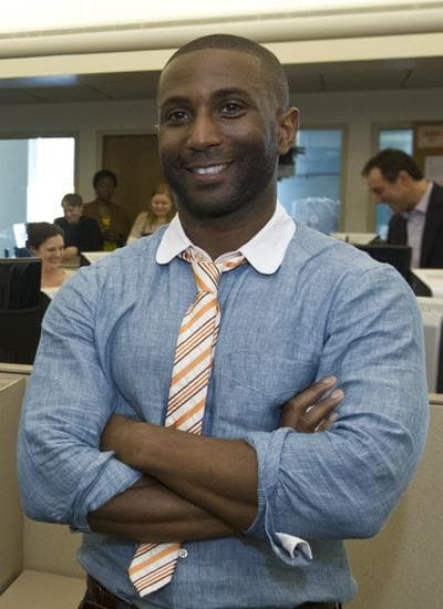 Boston Globe film critic Wesley Morris was awarded the 2012 Pulitzer Prize for criticism. In this April 16, 2012 photo, Morris stands during an announcement in the Globe's newsroom in Boston. (Matthew J. Lee, The Boston Globe/ AP)