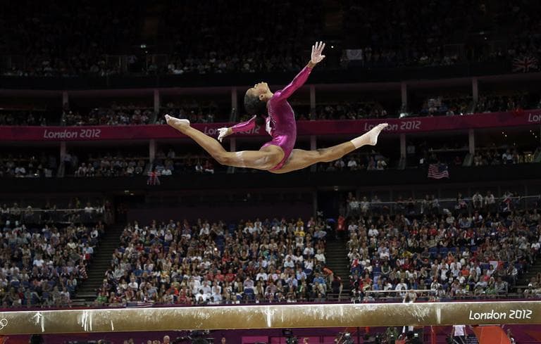 U.S. gymnast GabrielleDouglas performs on the balance beam during the artistic gymnastics women's individual all-around competition at the 2012 Summer Olympics, Thursday, Aug. 2, 2012, in London. (AP Photo/Gregory Bull)