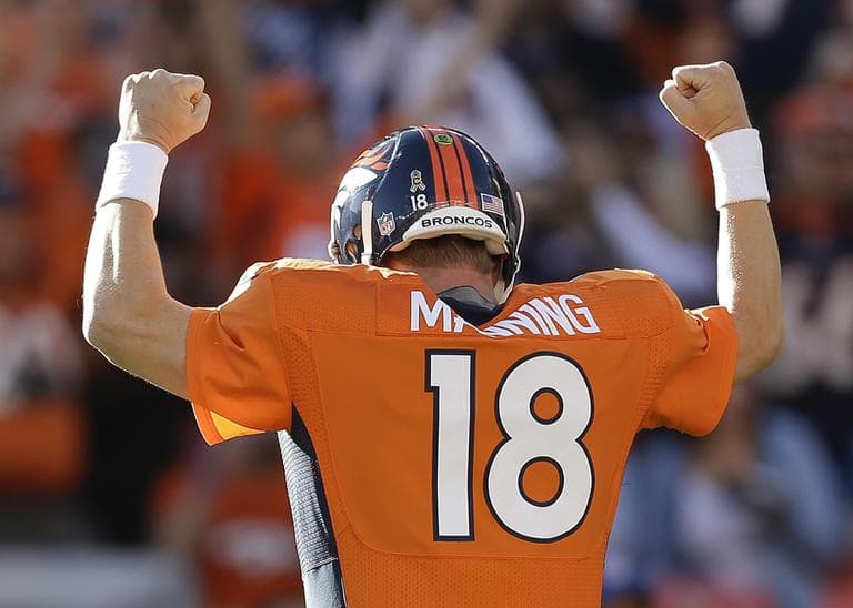 Quarterback Peyton Manning has led the Denver Broncos to eight straight wins, putting the team in a strong position heading into the postseason. (Joe Mahoney/AP)