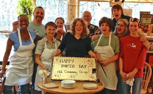 Old Creamery Co-Op staff with a birth day cake! (Photo courtesy of Old Creamery Co-Op)