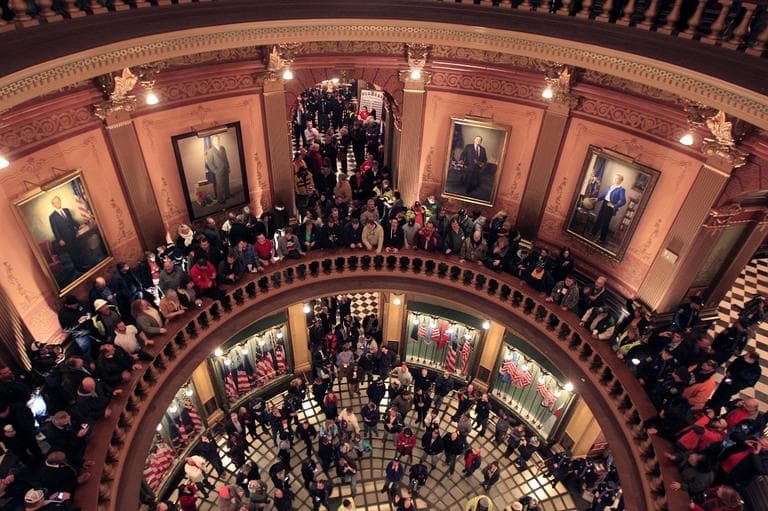 Union workers fill the entire of the Capitol rotunda in Lansing, Mich., Thursday, Dec. 6, 2012. Hundreds of chanting and cheering protesters streamed back into the Michigan Capitol after receiving a court order saying that the building must reopen. (AP/Carlos Osorio)