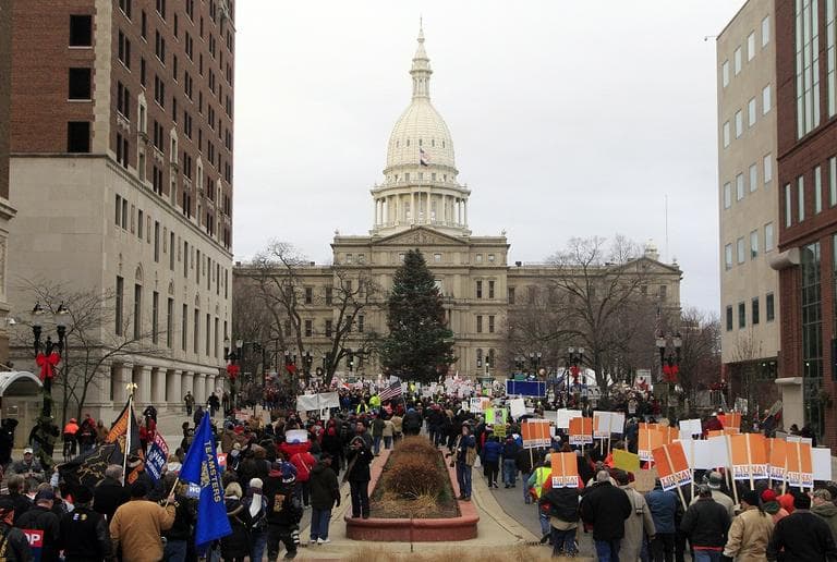 Thousands of supporter march to the State Capitol grounds in Lansing, Mich., Tuesday, Dec. 11, 2012.  (AP/Carlos Osorio)