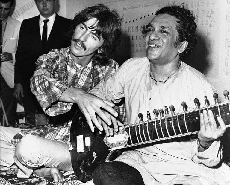 George Harrison of the Beatles sits cross-legged with his musical mentor, Ravi Shankar of India, a sitar virtuoso, in Los Angeles, Aug. 3, 1967. (AP)