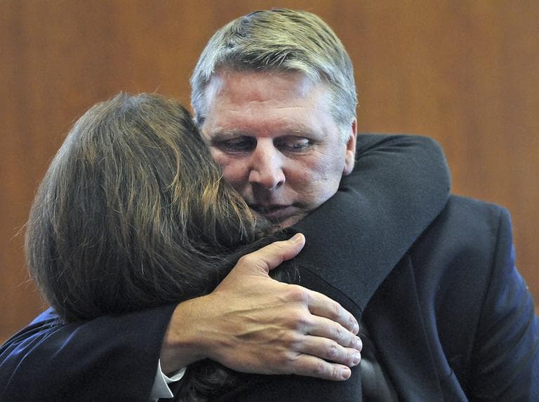 Former Treasurer Timothy Cahill embraces his wife Tina in Boston's Suffolk Superior Court after a judge declared a mistrial in his corruption case Wednesday. (Boston Herald/AP, Pool)
