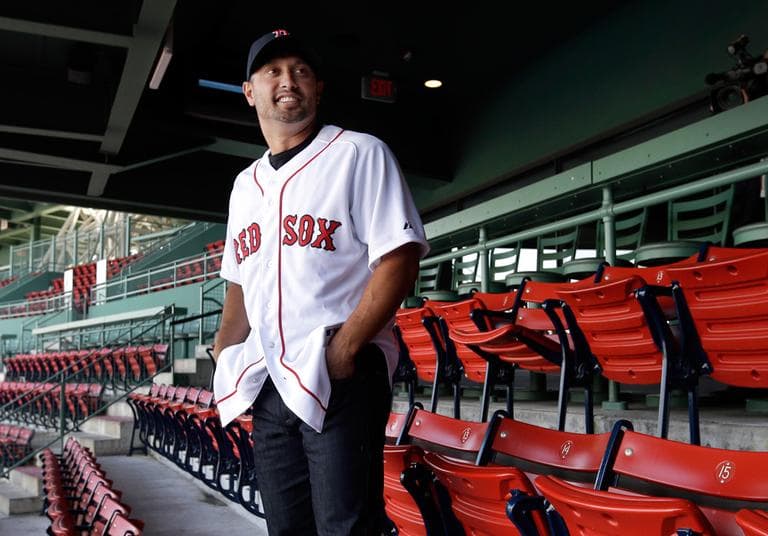 New Boston Red Sox outfielder Shane Victorino poses for photographers at Fenway Park after an introductory baseball news conference Thursday. (Elise Amendola/AP)
