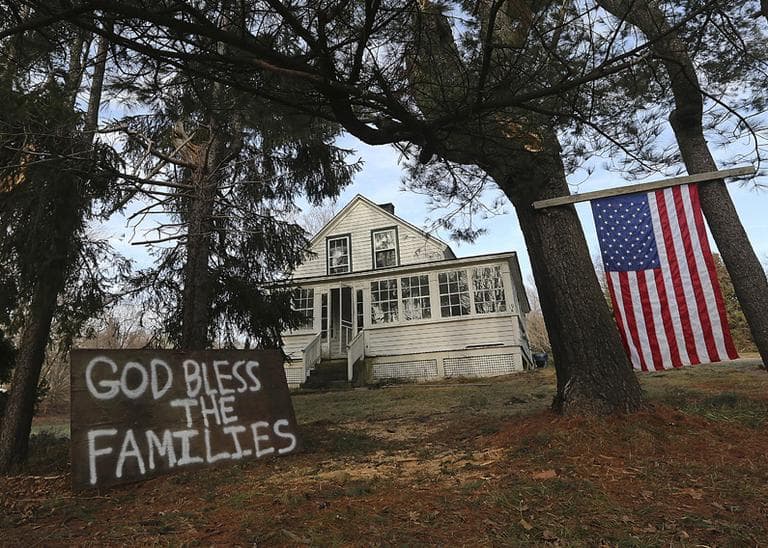 A sign in support of the victim's families is posted outside a house near Sandy Hook Elementary school,  Saturday, Dec. 15, 2012 in Newtown, Conn. (Mary Altaffer/AP)