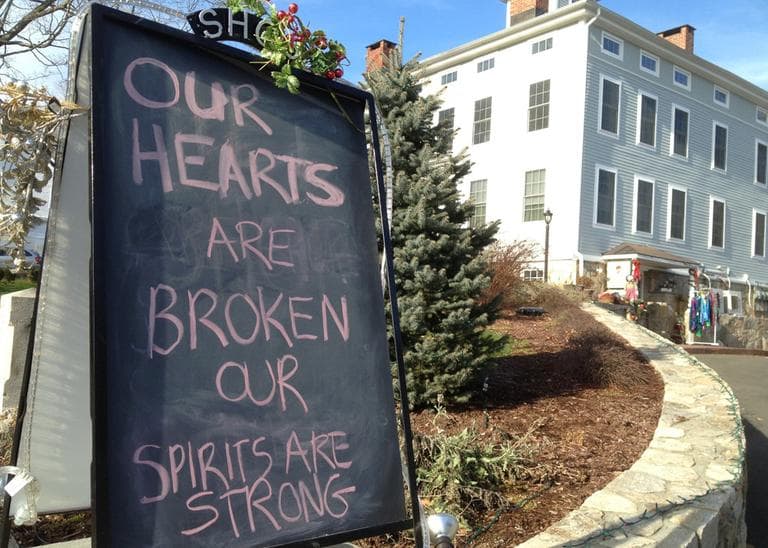 A condolence sign sits in downtown Sandy Hook, Conn., on Saturday, Dec. 15, 2012.  (Allen Breed/AP)