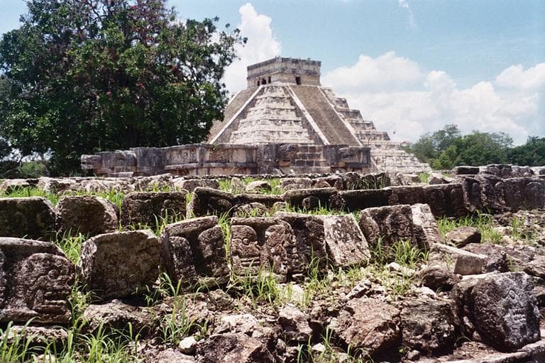 A frieze of skulls adorns the side of the Tzompantli, the platform probably used to exhibit sacrificed prisoners at the ancient Maya city of Chichen Itza, with the main pyramid, El Castillo, in the background, in Mexic. (AP)