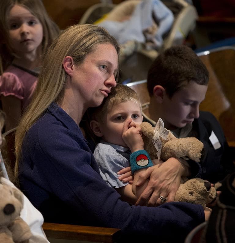 Residents wait for the start of an interfaith vigil on Sunday for the victims of the Sandy Hook Elementary School shooting in Newtown, Conn. (Evan Vucci/AP)