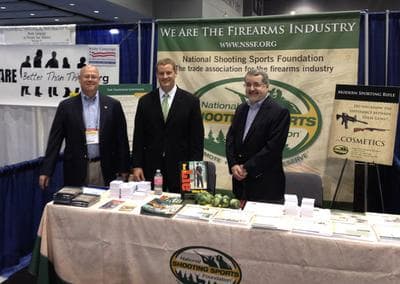 Representatives of The National Shooting Sports Foundation stand in their booth at the National Conference of State Legislatures in Chicago in August. From left, Lawrence G. Keane, NSSF senior vice president and general counsel; Jake McGuigan, NSSF director of government relations - state affairs; and Mike Bazinet, NSSF director of public affairs. (www.nssf.org)